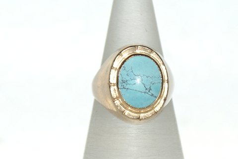 Gold ring with light blue stones