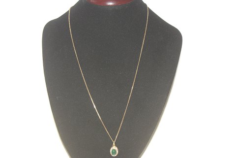 Elegant gold necklace with emerald in 14 carat gold and diamonds