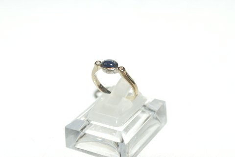 Elegant ladies ring in 14 carat gold with Brilliant and blue stones