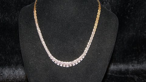 Block Necklace with course 5 rK with splicing and turning chain 14 carat
Stamped PCL 585
Length 42.5