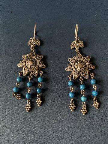 Beautiful and rustic silver earrings with inlaid turquoise.