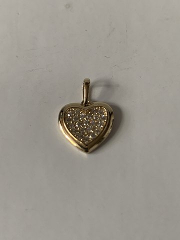 Heart-shaped pendant in 14 carat gold, with zircons. Very exclusive.