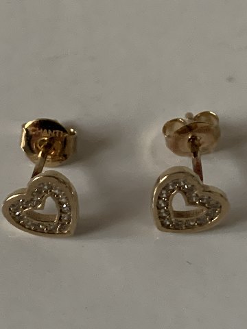 9 karat Gold heart earrings
with clear stones.