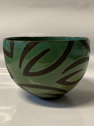 Ceramic glazed bowl, in green and brown colours.