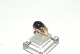 Elegant lady ring with purple stone in 8 carat gold