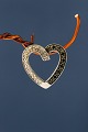 Pendant for chain, heart-shaped in 14k white gold, with diamonds.
Stamped 585 DS