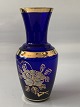 Blue vase with gold edge and nice pattern.