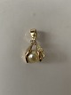 14k gold pendant with a pearl and a clear stone, stamped 14K.