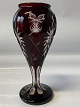 Bohemian crystal vase in deep red color, with beautiful patterns.