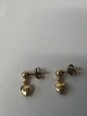 Hjerte øreringe i 14 karat guld.Længde 1,3 cm.
